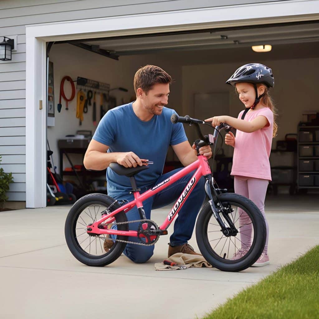 Adjusting a Kidvelo Rookie convertible bike seat and handlebars in front of a garage
