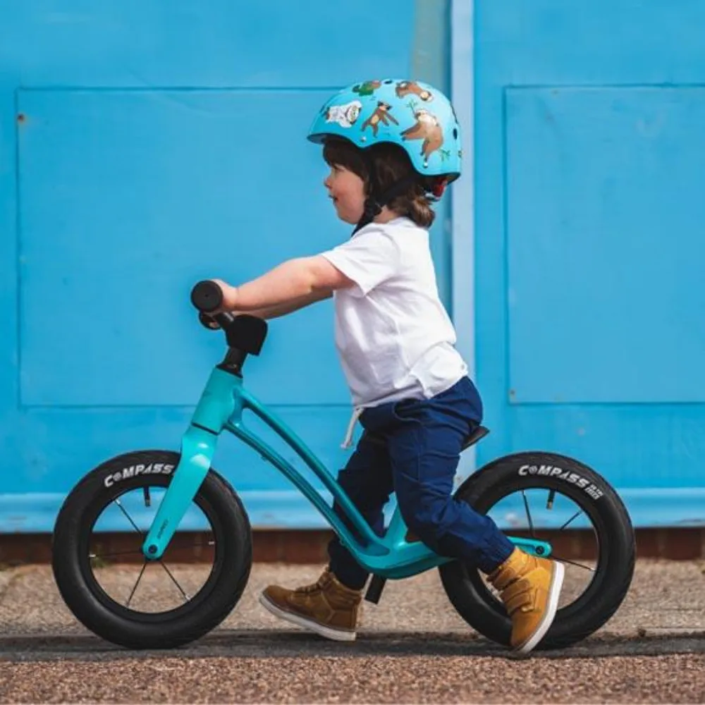 Kid on a Turqoise colour Hornit 12 inch Balance Bike