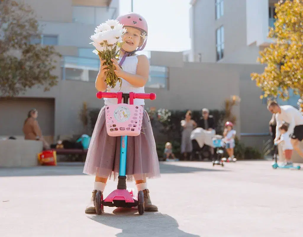 scooter with girl and flowers in her hands