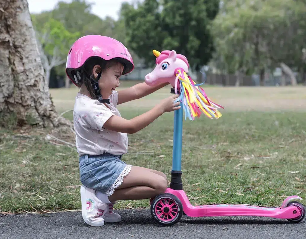 Children with 3 wheel scooter pink color